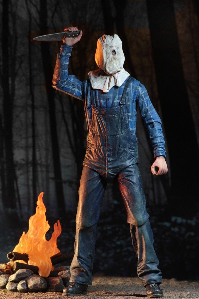 a statue of a man holding a knife in front of a campfire and wearing overalls