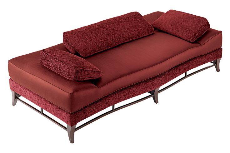 a red couch sitting on top of a wooden frame