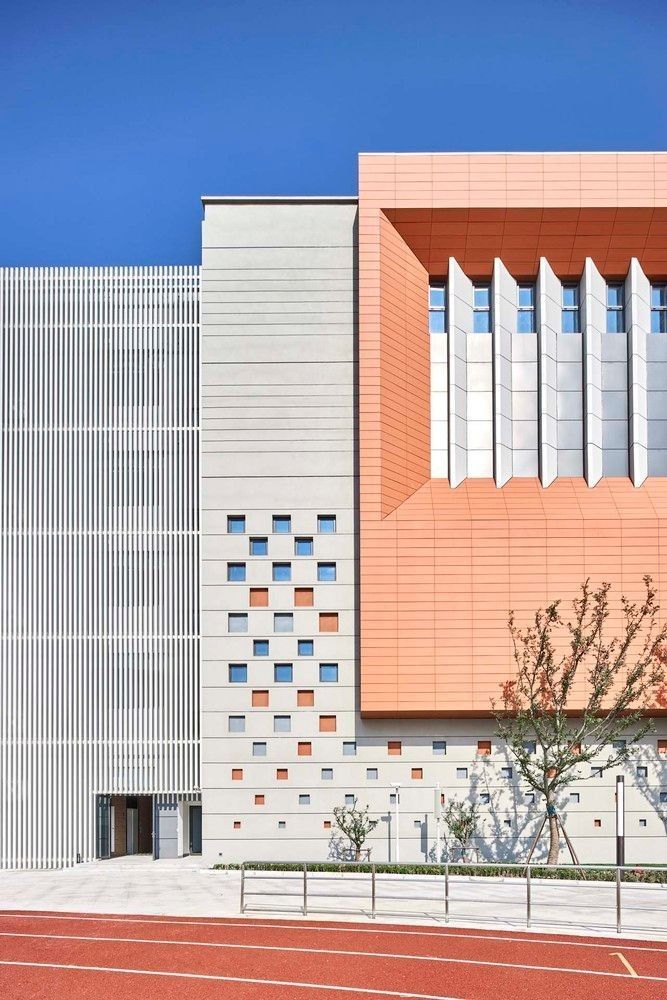 an orange and white building on the side of a road