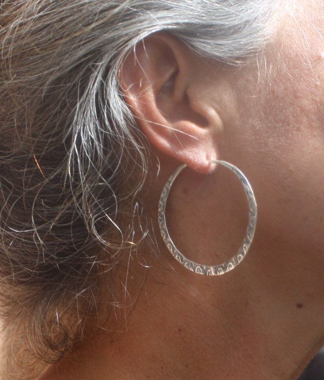 "Vintage Navajo Hand Stamped Hammered Hoop Earrings Reproduction Sterling Silver Design is a hand fabricated reproduction of an old Navajo design. They are handmade, light with beautiful ornate detailing. * Simple Wire Closure that is seamlessly integrated into the design Materials: Sterling Silver Length: approx. 1.90\" Width: approx. 1.90\"" Traditional Hammered Silver Earrings, Traditional Silver Hammered Earrings, Artisan Hand Forged Earrings, Hand Forged Artisan Earrings, Etched Hoop Earrings As Gift, Artisan Silver Round Hoop Earrings, Handmade Southwestern Hoop Jewelry, Traditional Adjustable Small Hoop Jewelry, Handmade Southwestern Style Hoop Jewelry