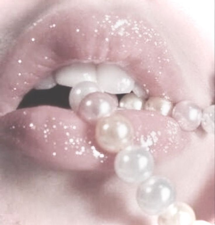 a woman's lips with pearls on them