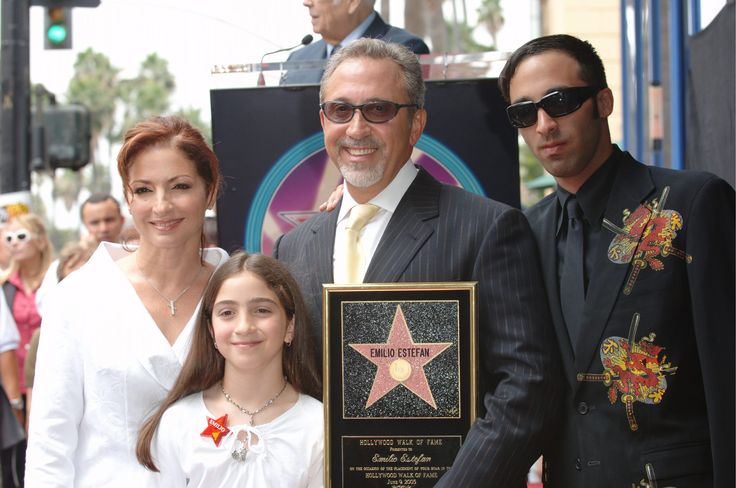 a man and two women holding a star on the hollywood walk of fame