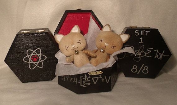 two stuffed animals in a box with writing on it