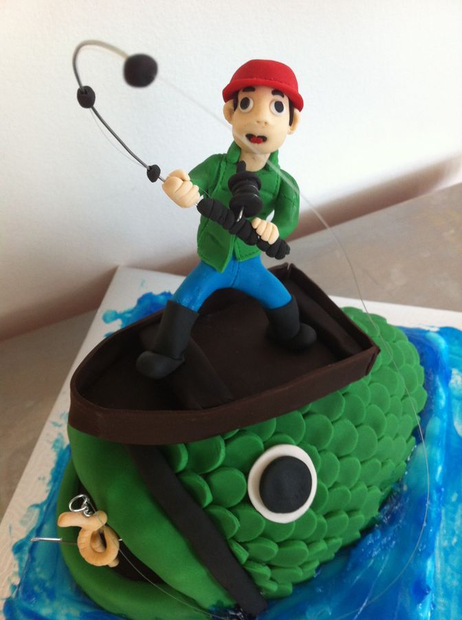 there is a cake that looks like a pirate on top of a green sea creature