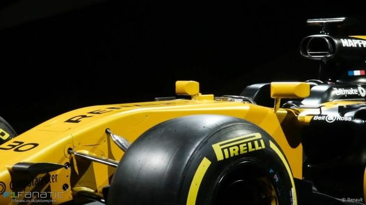 a yellow race car is shown in the dark