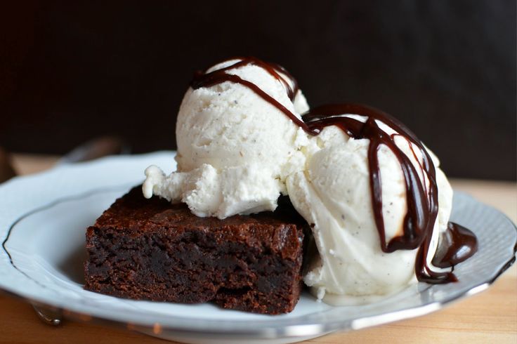 two pieces of chocolate cake with ice cream on top