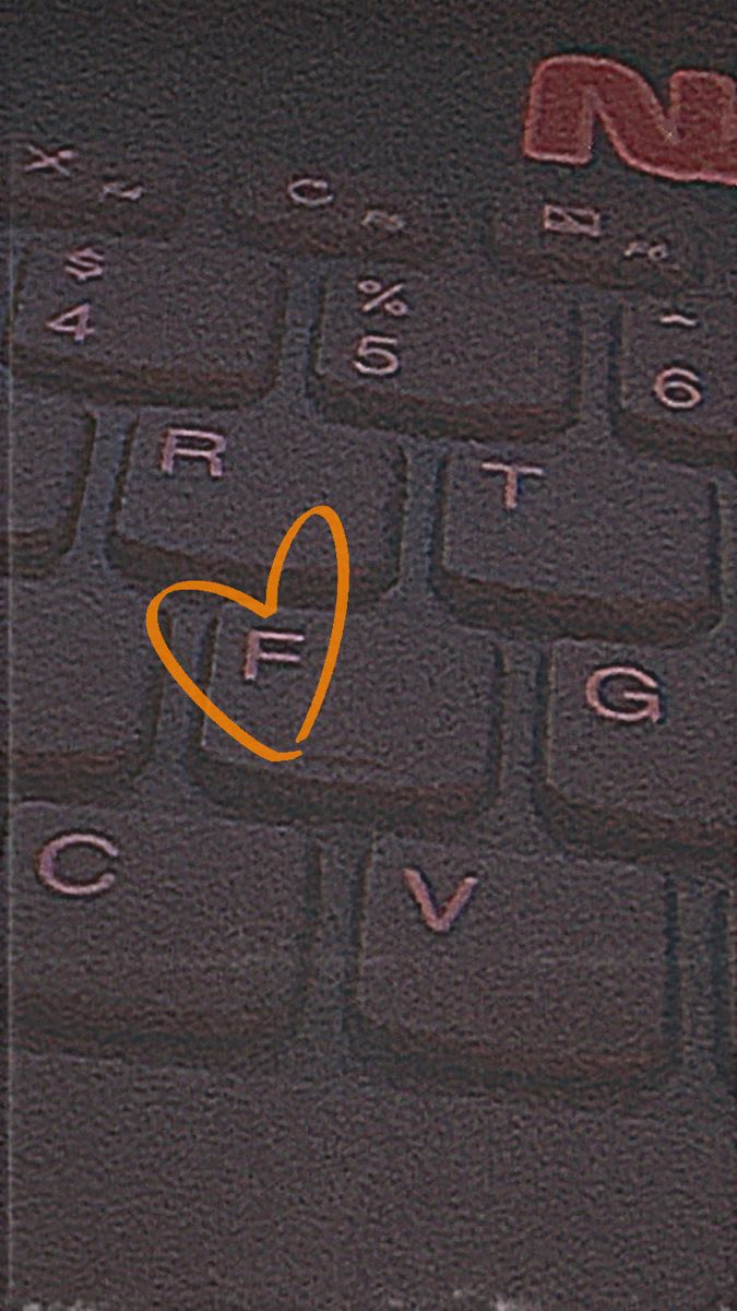 a heart drawn on the keyboard of a cell phone