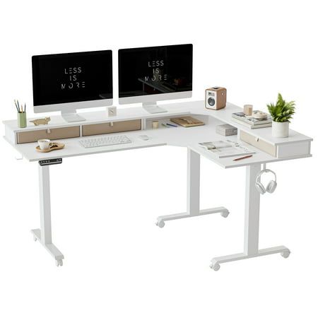 two computer monitors sitting on top of a white desk