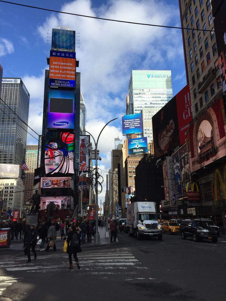 people crossing the street in times square, new york city