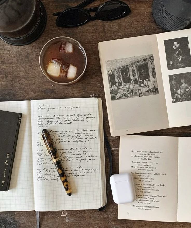 an open book sitting on top of a wooden table