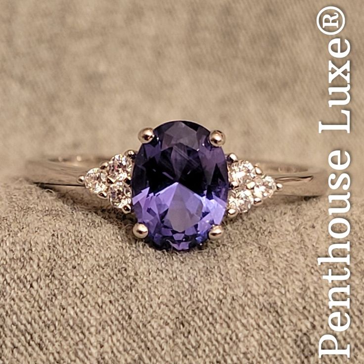 Oval Cut 6x8mm Lab Tanzanite With Brilliant Cut Cubic Zirconia Accents. The Band And Setting Are Crafted From Solid 925 Sterling Silver And Engraved "S925". Guaranteed 100% Genuine. All Photos Show Actual Rings For Sale And Are Property Of Penthouse Luxe Jewelry. Related: Real Genuine Authentic Certified 925 Blue Violet Purple Periwinkle Bluish Gem Rock Stone Zoisite Vanadium Epidote Mineral December Month Birthstone Sagittarius Zodiac Astrology Good Cut Great Quality Engagement Round Circle Acc Floating Diamond Ring, December Month, Purple Periwinkle, Rings Crystal, Party Queen, Sky Light, Sagittarius Zodiac, Luxe Jewelry, Wedding Rings Solitaire