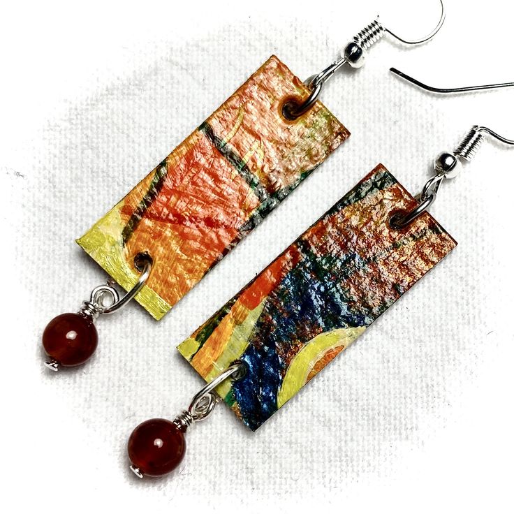 Make a Fashion Statement!  Wearable Art on your ears--Mixed Media Abstract on 300 pound Watercolour paper sealed with Gloss Medium and embellished with glass or semiprecious beads. Free shipping and if you live in Victoria, BC, you can find a selection of these unique earrings at the Gage Gallery Artists Collective, 19 Bastion Square, Victoria, BC. Please inquire before you order, as your selection may have sold already. I can also customize for you. Thank you! Artistic Colorful Beaded Earrings For Gifts, Artistic Colorful Beaded Earrings As Gift, Artistic Earrings With Colorful Beads For Gift, Artistic Earrings With Colorful Beads As Gift, Rectangular Jewelry With Dangling Beads For Gifts, Gift Jewelry With Dangling Rectangular Beads, Artsy Colorful Beaded Earrings As Gift, Artsy Earrings With Colorful Beads As Gift, Multicolor Rectangular Beaded Earrings As Gift