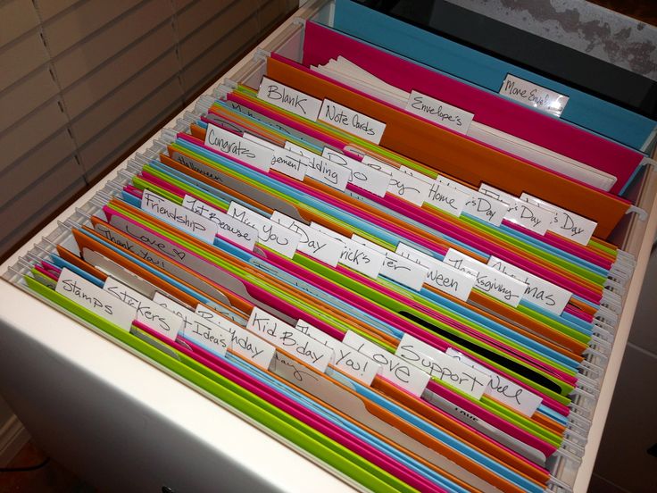 a drawer full of file folders with labels on them