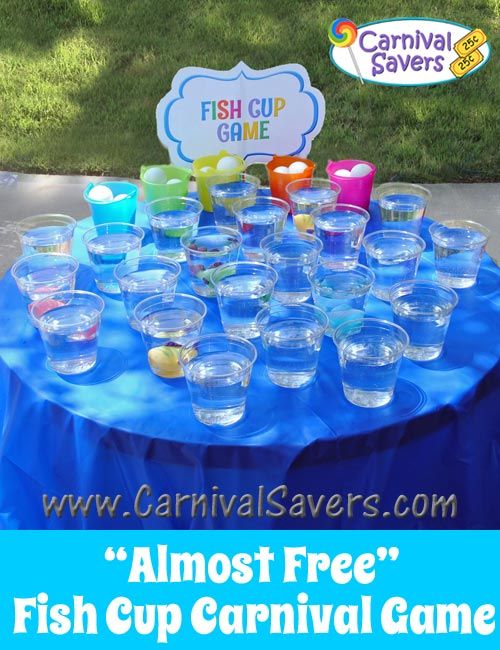 there are many cups on the table with fish cup game in front of them and a sign that says carnival savers