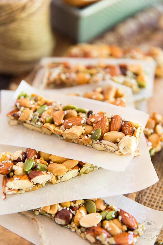 three pieces of fruit and nut bar on top of each other