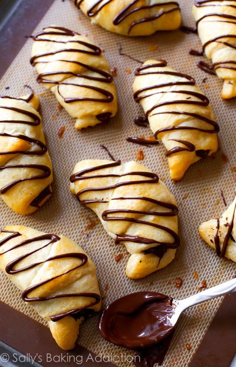 chocolate drizzled on pastries with a spoon