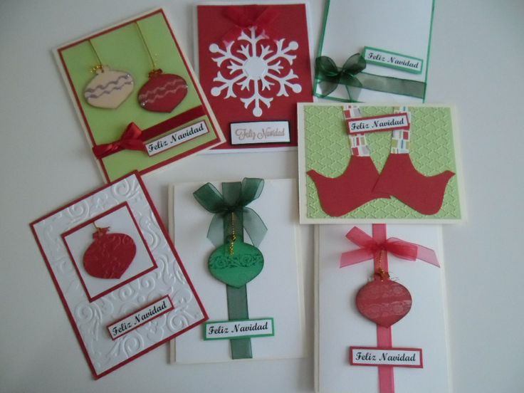 several cards with different designs on them and some tags attached to the back of each card