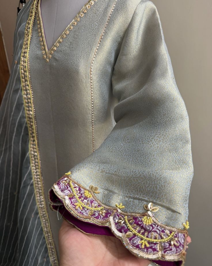 Introducing our stunning grey embroidered outfit, crafted with exclusive materials that bring out the beauty of sharp, vibrant colors 🌸✨ This piece is adorned with intricate floral embroidery, making it a perfect blend of tradition and contemporary style. It’s not just an outfit; it’s a statement for the upcoming festive season 🎉 Brides-to-be, this is a must-have for your trousseau! Its chic and stylish design will leave everyone in awe 💍👗 Don’t miss out on this elegant masterpiece! Printed Suit Embroidery Design, Embroidered Suits For Women, Embroidered Outfit, Silk Kurti Designs, Punjabi Suits Designer Boutique, Trendy Outfits Indian, Embroidery Fashion Detail, Classy Outfits For Women, Casual Indian Fashion