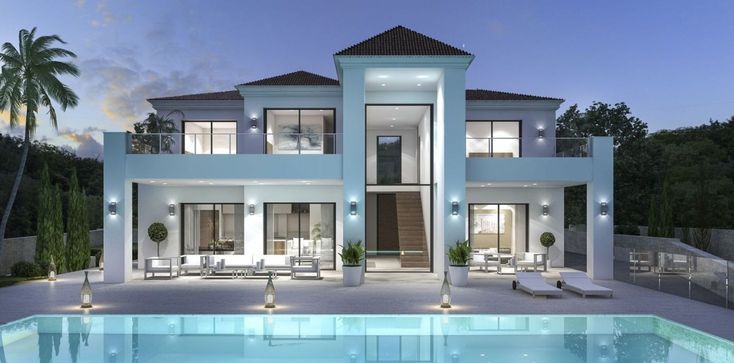 a large white house with a swimming pool in front of it at night, surrounded by palm trees