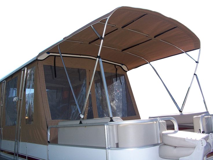 a boat is parked on the water with a canopy over it's head and seats