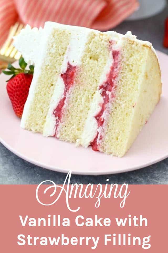 a slice of vanilla cake with strawberry filling on a plate