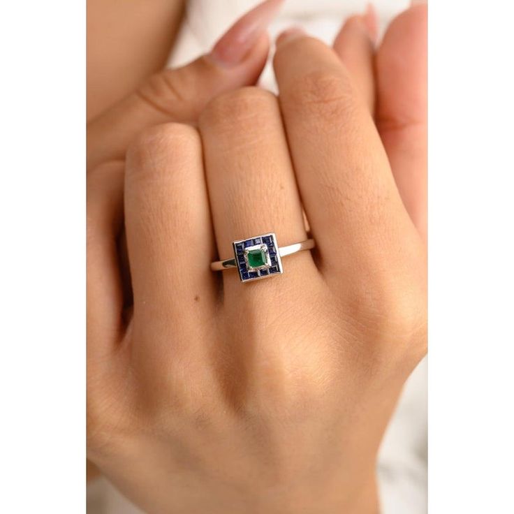 This is part of Chairish’s Fine Jewelry assortment.  Art Deco Blue Sapphire Emerald Square Shape Ring in 14K Gold featuring natural blue sapphire and emerald of 0.59 carats. The gorgeous handcrafted ring goes with every style. Sapphire stimulates concentration and reduces stress and emerald enhances the intellectual capacity. Designed with square cut blue sapphire and emerald making a square that makes it a perfect fit to wear it on your occasion or style it with any of your basic outfit to give it a glam. This is a perfect Handmade Jewelry, Bridal Shower Gift, Valentine Gift, Gift For Sister, Mother Daughter Gift, Bride To Be Gift, Bridesmaid Gift, Mom Gift, BFF Gift, Best Friend Gift, Anniversary Present, Wife Gift, Gift for Her or any Holiday Gift for Mother, Sister, Daughter, Grandma, Green Sapphire Birthstone Rings, Blue Emerald Ring For May Birthstone, Round Shape, Blue Emerald Ring For May Birthstone, Green Sapphire Rings With Halo Setting, Blue Emerald Promise Ring In Fine Jewelry Style, Fine Jewelry Blue Emerald Promise Ring, Sapphire Solitaire Ring, May Birthstone, Fine Jewelry, Solitaire Sapphire Ring May Birthstone, Solitaire Sapphire Ring For May Birthstone