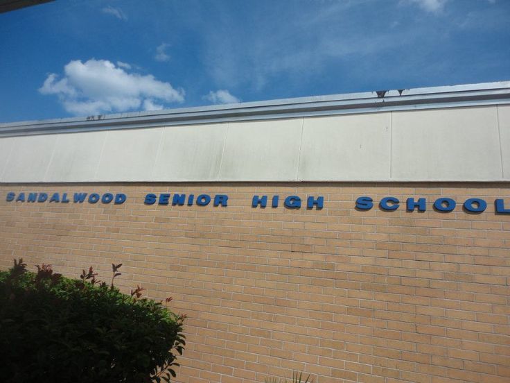 a brick building with the words london high school written on it's front wall