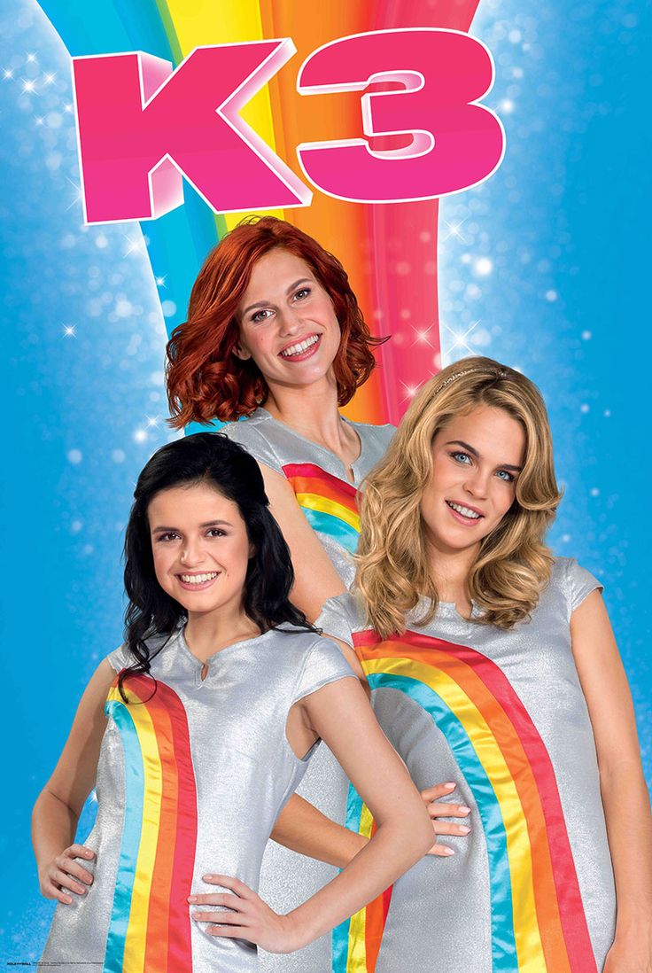 the k - 3 girls are standing in front of a rainbow colored background with their arms around each other