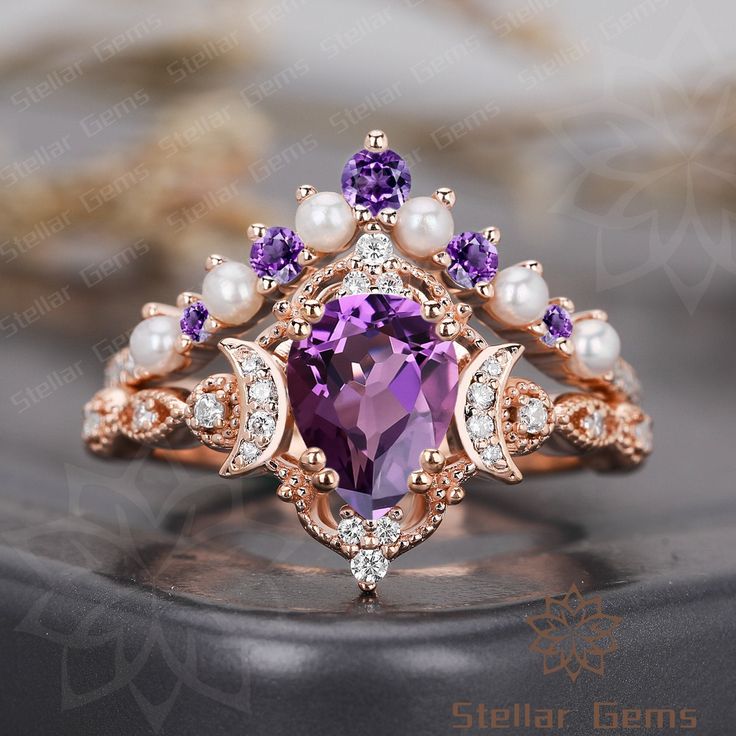 an amethorate ring with pearls and purple stones on the sides, set in 18k rose gold