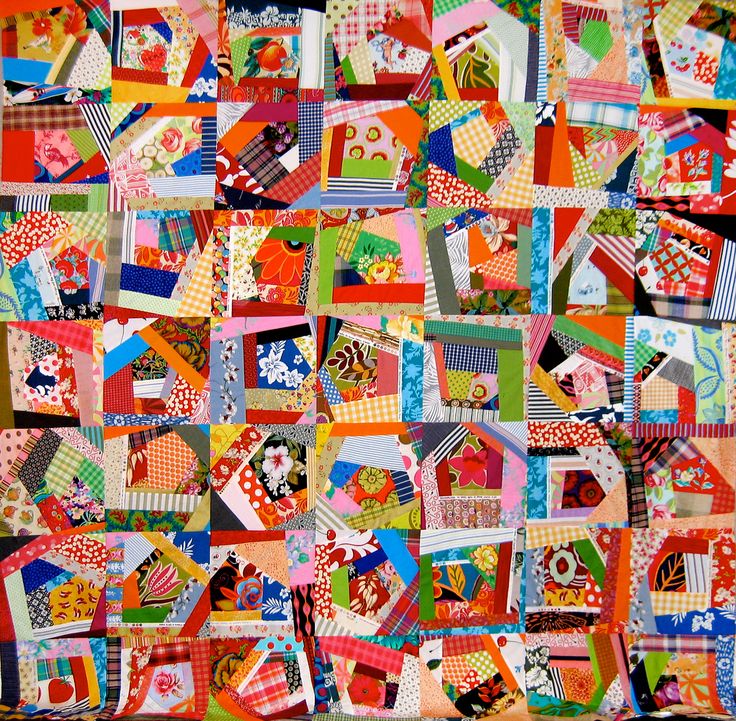 a colorful quilt with many different designs on it