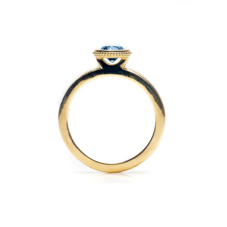 This modern 18K yellow gold ring with a solitary style setting holds a half carat round stone. PRICE IS FOR THE SETTING. Stone costs vary. *All pieces are made to order* Luxury 14k Gold Round Sapphire Ring, Modern Yellow Gold Topaz Ring With Center Stone, Modern Topaz Ring With Center Stone In Yellow Gold, Elegant Yellow Gold Wedding Rings With Bezel Setting, Elegant Round Halo Ring With Bezel Setting, Yellow Gold Topaz Ring, Formal Blue Topaz Ring With Bezel Setting, Modern Yellow Gold Birthstone Ring With Center Stone, Classic Round Birthstone Ring With Bezel Setting