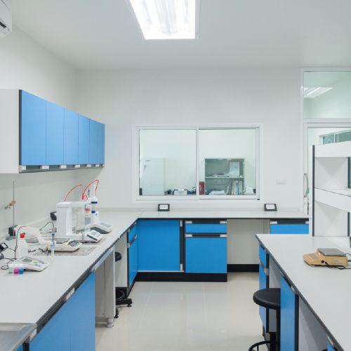 a lab with blue cabinets and white counter tops