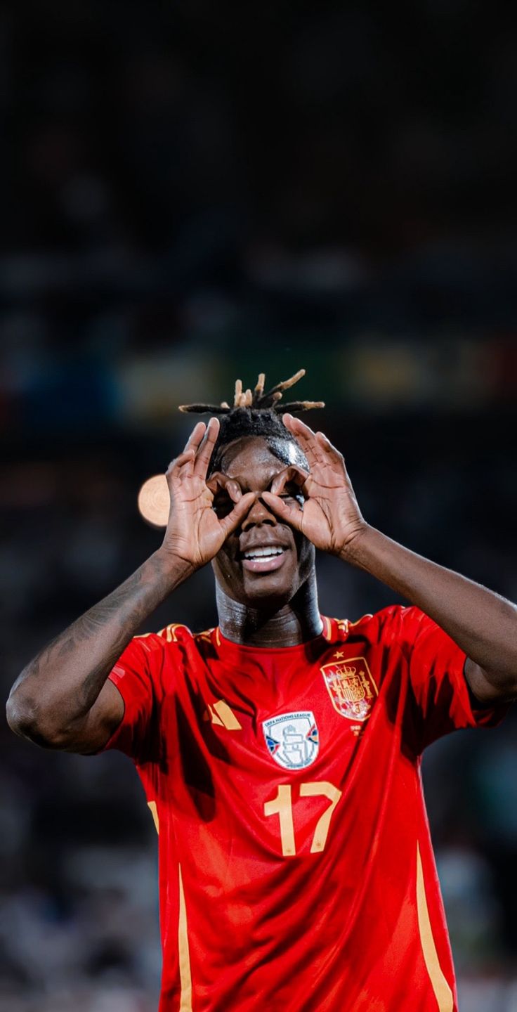 a soccer player holding his head with both hands