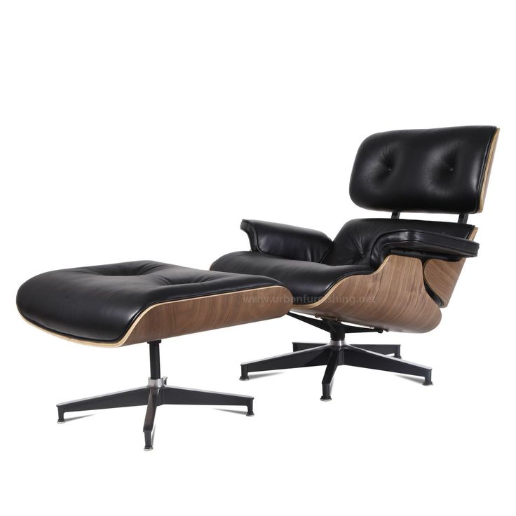 an eames lounge chair and ottoman with black leather upholstered on the back