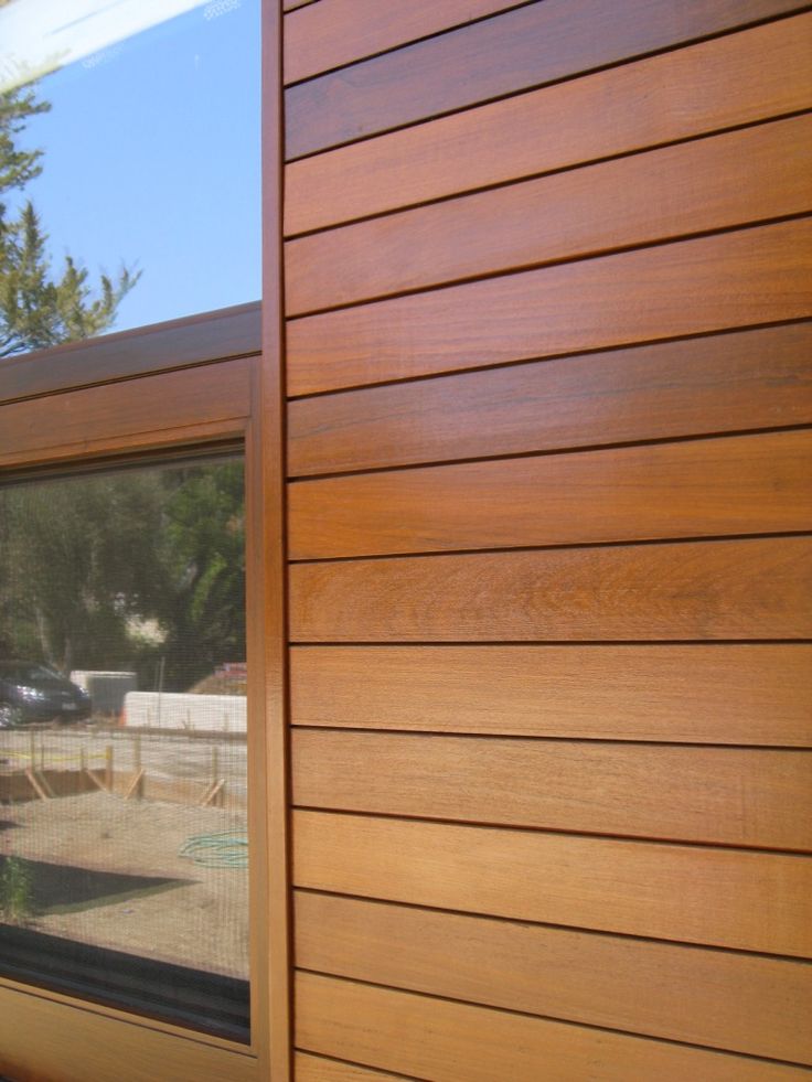 the side of a house with wood siding