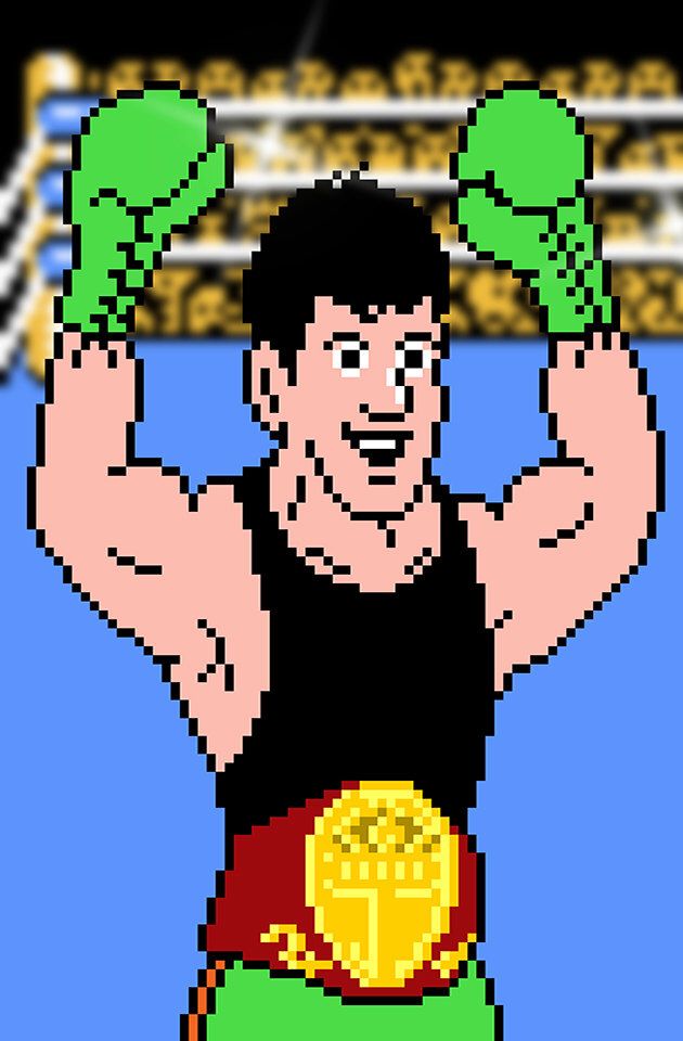 an old - school video game with a wrestler holding his fist up in the air