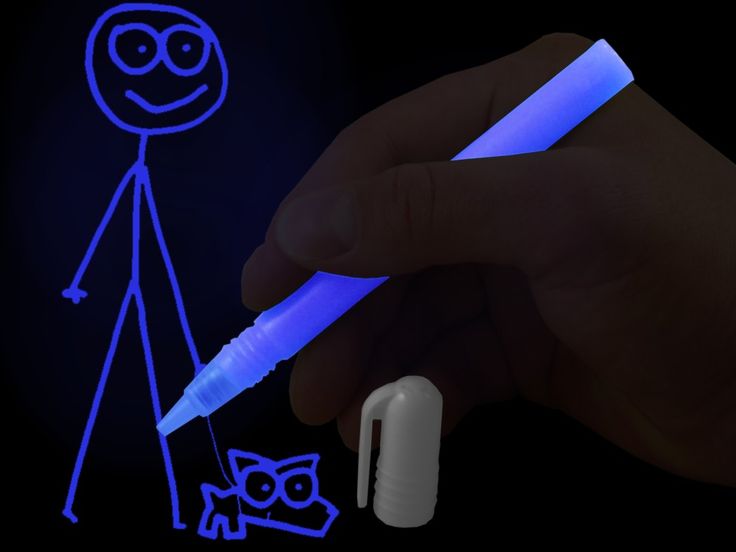 a hand holding a blue light up pen next to a drawing of a person