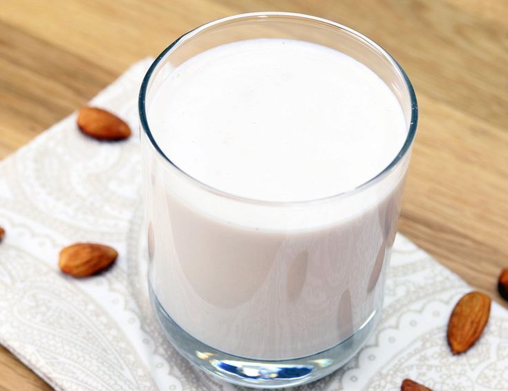 almond milk in a glass on a napkin