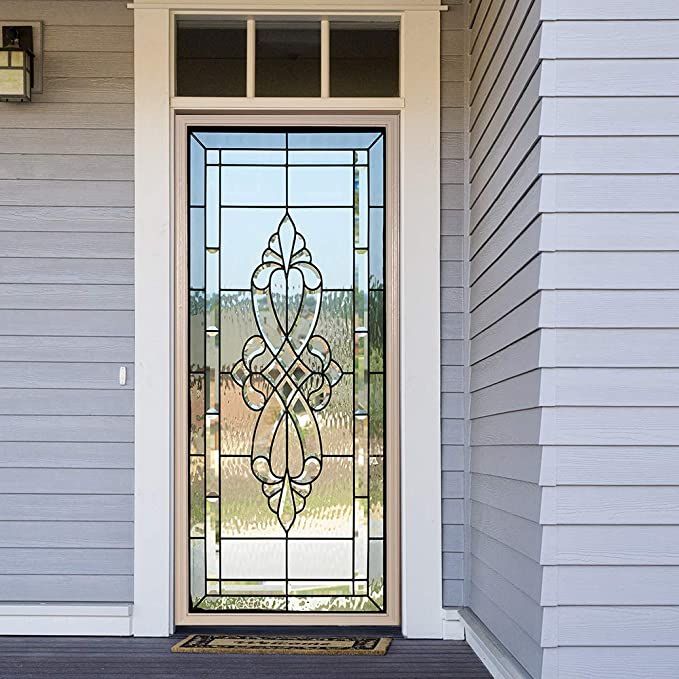 the front door to a house with a decorative glass window on it's side