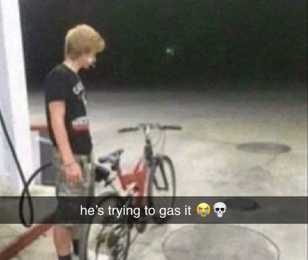 a young boy standing next to a bike with the caption he's trying to gas it