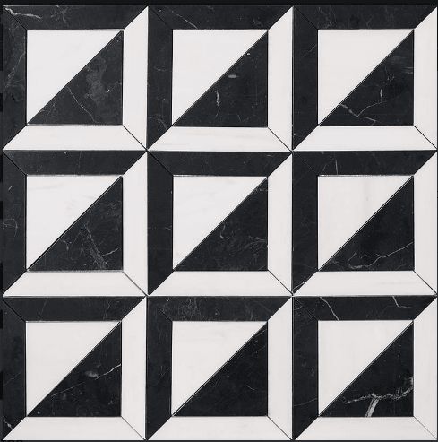 a black and white tiled wall with geometric shapes