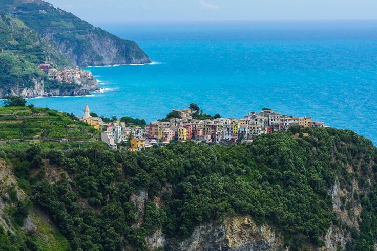 an aerial view of a town on the edge of a cliff