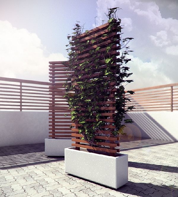 a tall planter sitting on top of a white bench next to a wooden fence