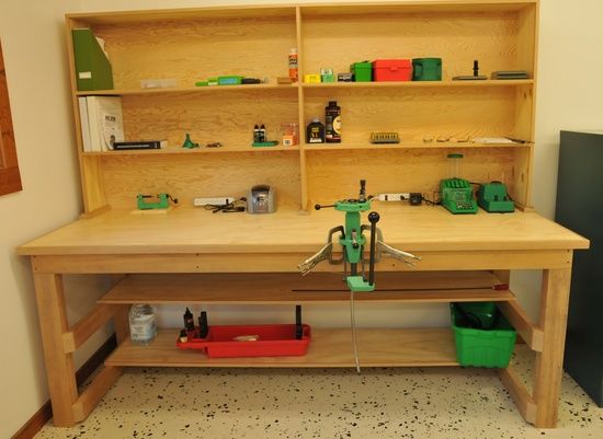 a workbench with tools on it in a room