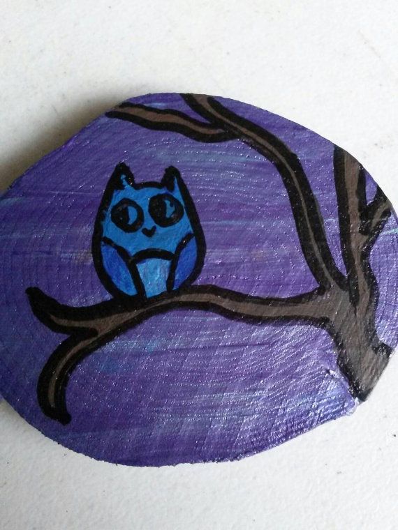 a painted owl sitting on a tree branch with purple sky in the background and black outline