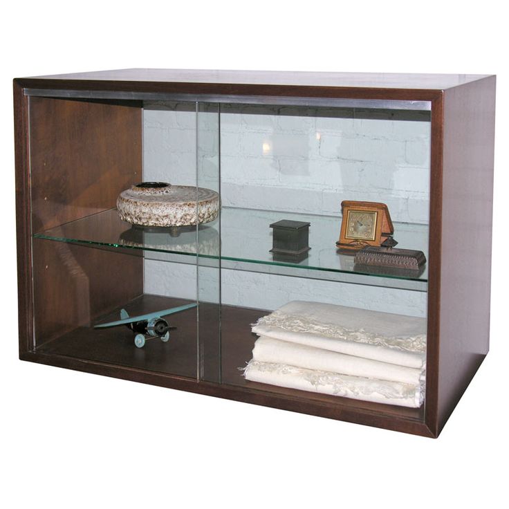 a display case with glass shelves filled with items