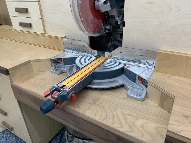 a circular saw is being used to cut wood with a mitting blade on a workbench