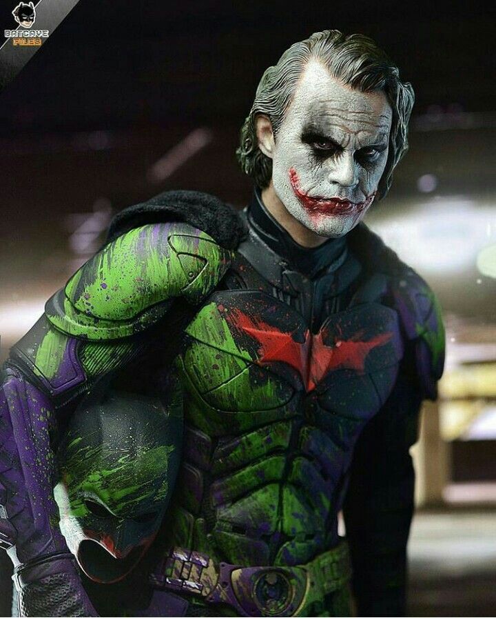 a man dressed as the joker is posing for a photo