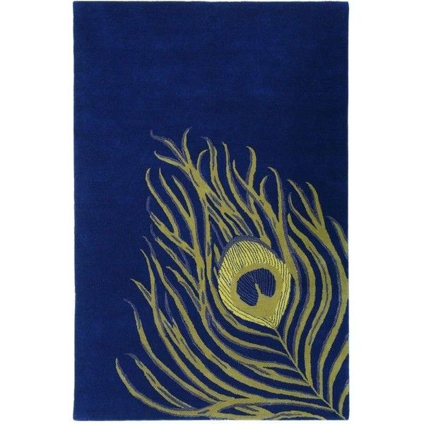 a blue and gold rug with a peacock's eye on it