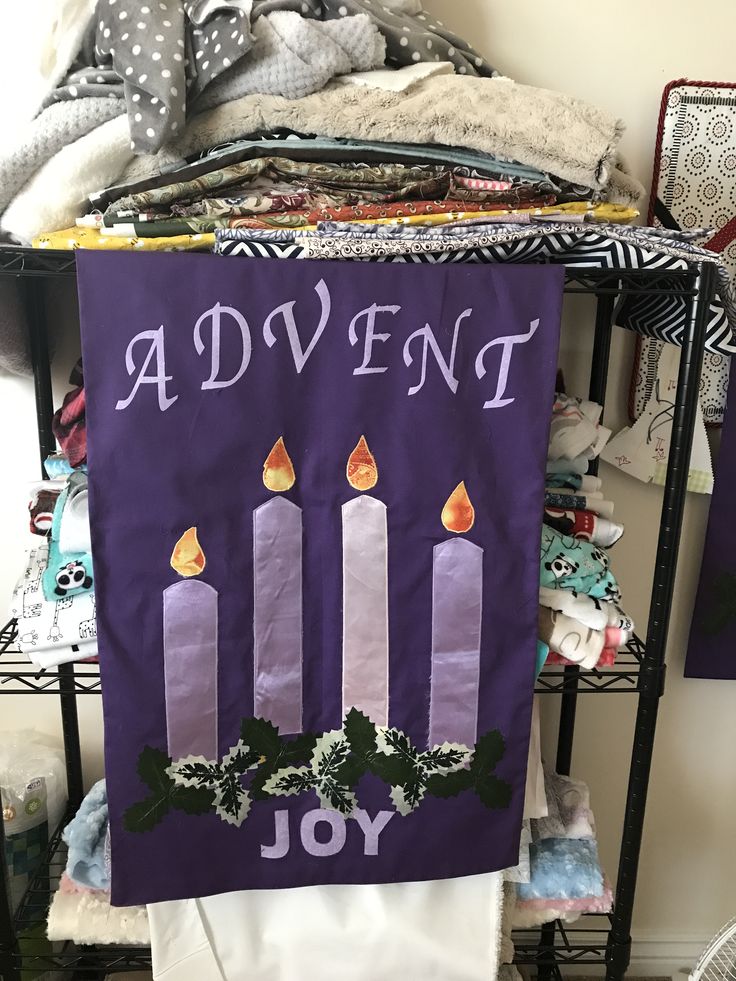 a purple banner with candles and holly on it that says, a adventent joy